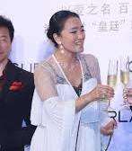 Gong Li consuming alcohol